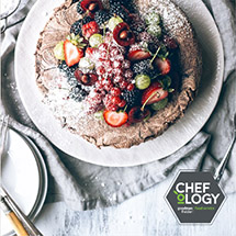 Chocolate cake topped with fresh fruits 