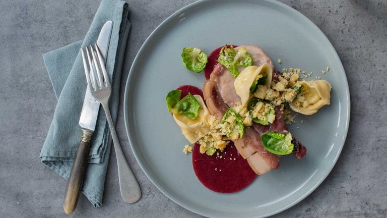 Image of the plated dish of a slow braised pork cutlet