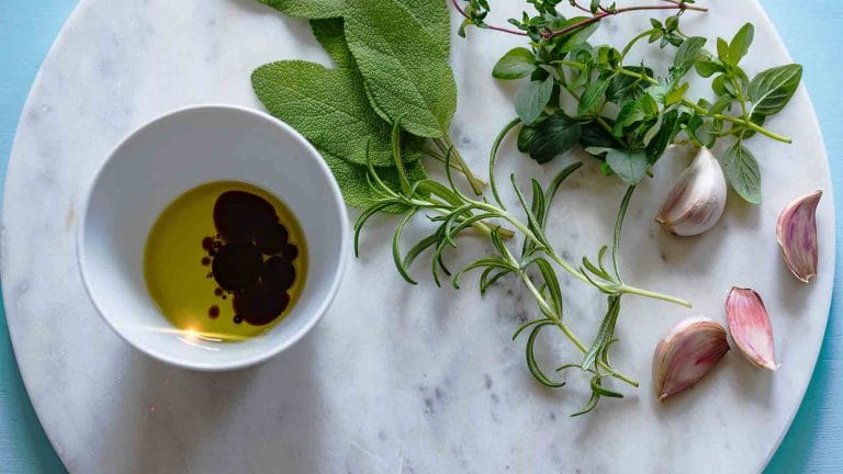 A photo showing oil in a bowl on a kitchen bench