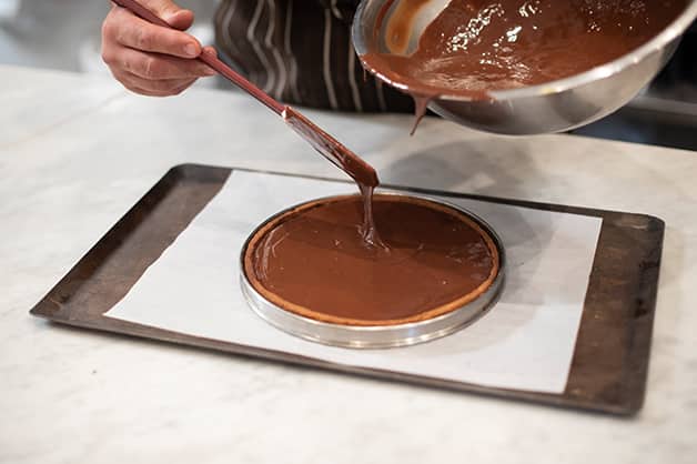 Pouring the mixture into the tart shell