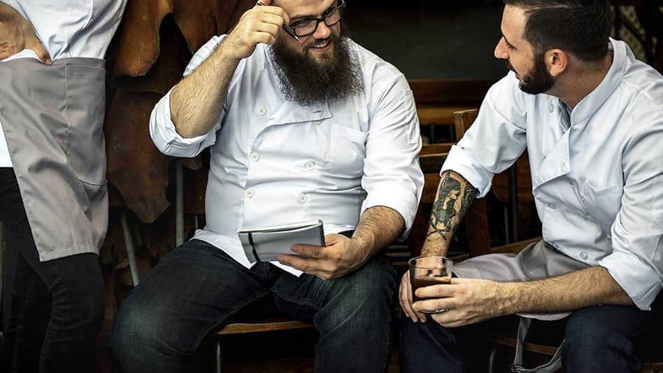 Two chefs sharing a chat